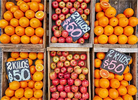 Fresh apples and oranges in crates on market stall, Montevideo, Uruguay, South America Stock Photo - Premium Royalty-Free, Code: 649-09078592