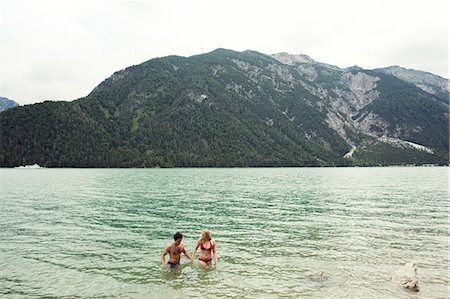 simsearch:649-07648564,k - Couple waist deep in water, Achensee, Innsbruck, Tirol, Austria, Europe Stock Photo - Premium Royalty-Free, Code: 649-09111259