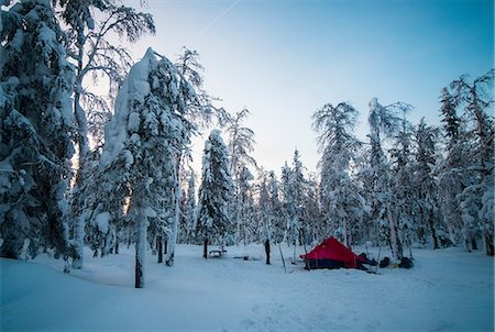 simsearch:649-09149073,k - Man standing beside tent in snow covered forest, Russia Stock Photo - Premium Royalty-Free, Code: 649-09111575