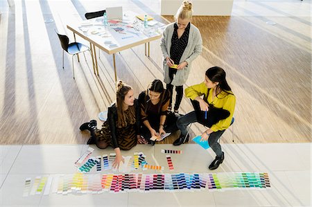 simsearch:649-08117902,k - Colleagues sitting on floor working with colour swatches Stock Photo - Premium Royalty-Free, Code: 649-09111592