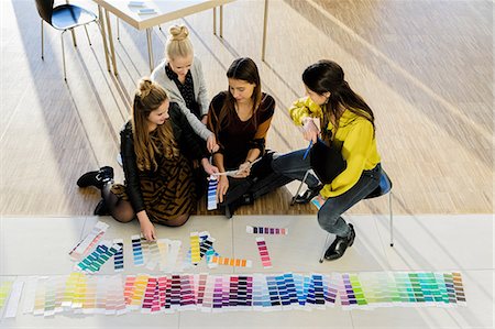 simsearch:649-06532529,k - Colleagues sitting on floor working with colour swatches Stock Photo - Premium Royalty-Free, Code: 649-09111593