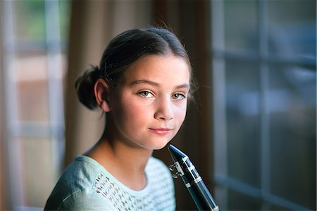 Young clarinettist posing with her clarinet Stock Photo - Premium Royalty-Free, Code: 649-09111631