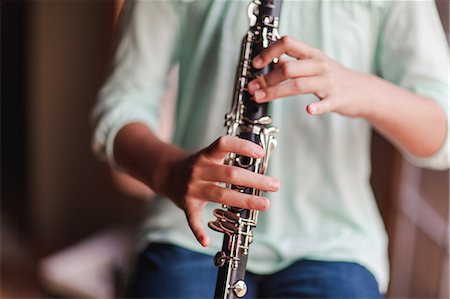 Young clarinettist playing her clarinet Stock Photo - Premium Royalty-Free, Code: 649-09111632