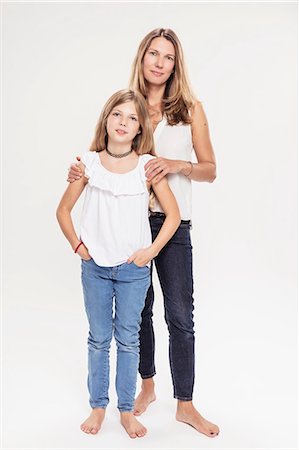 full body portraits people - Studio portrait of mature woman with daughter, full length Stock Photo - Premium Royalty-Free, Code: 649-09111654