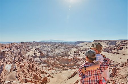 Boy and his brother looking out over desert landscape, Atacama, Chile Fotografie stock - Premium Royalty-Free, Codice: 649-09123215