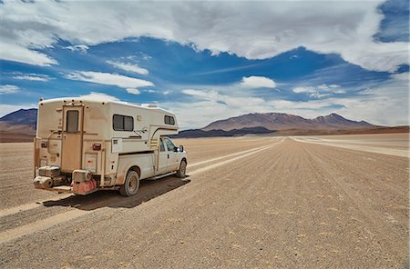 Recreational vehicle, travelling across landscape, rear view, Villa Alota, Potosi, Bolivia, South America Stock Photo - Premium Royalty-Free, Code: 649-09123269