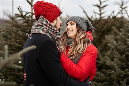 simsearch:649-09139103,k - Romantic young couple shopping for christmas tree from forest Photographie de stock - Premium Libres de Droits, Code: 649-09123765