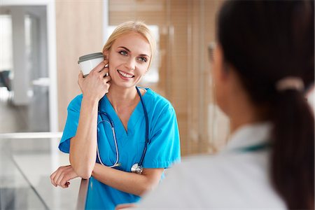 doctors coffee - Doctor and surgeon talking in hallway Stock Photo - Premium Royalty-Free, Code: 649-09123923
