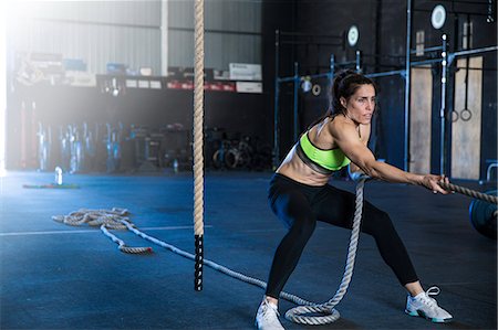 simsearch:649-09139139,k - Woman exercising in gymnasium, sled training Stock Photo - Premium Royalty-Free, Code: 649-09139147