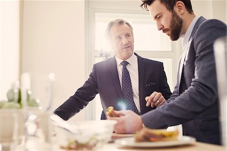 simsearch:614-06814076,k - Businessmen meeting over working lunch Stock Photo - Premium Royalty-Free, Code: 649-09139285