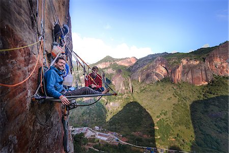 survival - Portrait of two rock climbers on portaledge, Liming, Yunnan Province, China Stock Photo - Premium Royalty-Free, Code: 649-09148464