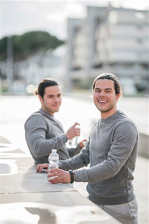 simsearch:649-09111421,k - Young adult male twins taking a training break, portrait Stock Photo - Premium Royalty-Free, Code: 649-09148648