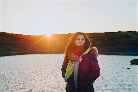 Woman by sea at sunset, Liscannor, Clare, Ireland Stock Photo - Premium Royalty-Free, Code: 649-09148733