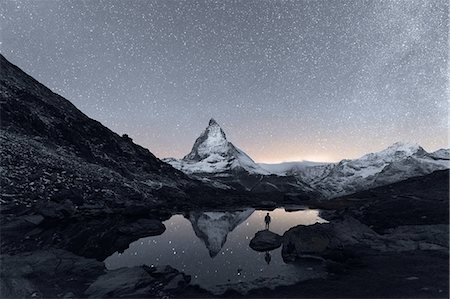 Matterhorn reflecting over Lake Riffelsee at night, Zermatt, Valais, Switzerland Stock Photo - Premium Royalty-Free, Code: 649-09148829