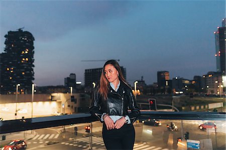 simsearch:614-08030826,k - Portrait of mid adult woman standing on balcony at dusk, pensive expression Stock Photo - Premium Royalty-Free, Code: 649-09148929