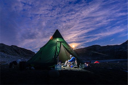 simsearch:649-09149073,k - Man sitting in illuminated tent at sunset, Narsaq, Vestgronland, South Greenland Stock Photo - Premium Royalty-Free, Code: 649-09149071