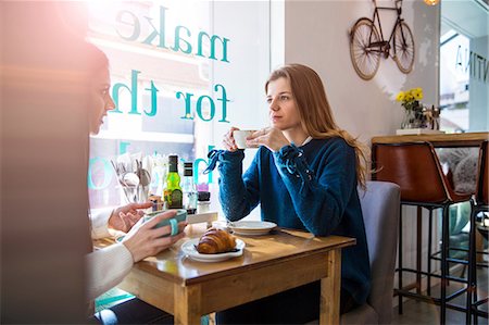 pastries woman cafe - Two female friends sitting together in cafe, drinking coffee Stock Photo - Premium Royalty-Free, Code: 649-09149127