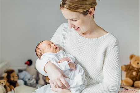 simsearch:649-07437409,k - Mother holding newborn baby girl, smiling Stock Photo - Premium Royalty-Free, Code: 649-09155701