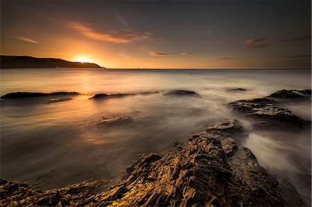 Scenic view of Chapel Rock at sunset, Perranporth, Cornwall, England Stock Photo - Premium Royalty-Free, Code: 649-09155703