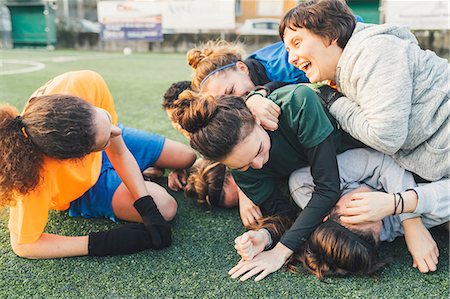 rolling over - Football players jubilant and hugging on pitch Stock Photo - Premium Royalty-Free, Code: 649-09155820