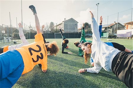 resilient - Football players in plank position on pitch Stock Photo - Premium Royalty-Free, Code: 649-09155853