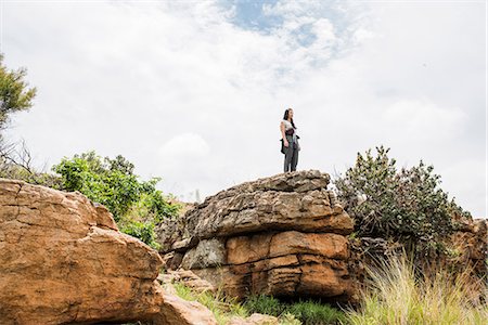 simsearch:649-09156185,k - Young female tourist looking out from rock at Bourkes Potholes, Mpumalanga, South Africa Foto de stock - Royalty Free Premium, Número: 649-09156190