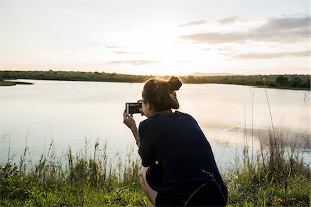 simsearch:649-09148811,k - Young female tourist photographing river in Kruger National Park, South Africa Stock Photo - Premium Royalty-Free, Code: 649-09156192