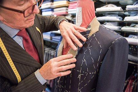 simsearch:649-09158921,k - Tailor preparing bespoke suit jacket on tailors dummy Photographie de stock - Premium Libres de Droits, Code: 649-09158890