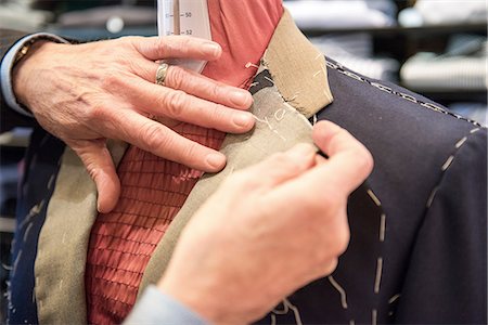 simsearch:649-09158921,k - Tailor preparing bespoke suit jacket on tailors dummy, close up of hands Photographie de stock - Premium Libres de Droits, Code: 649-09158891
