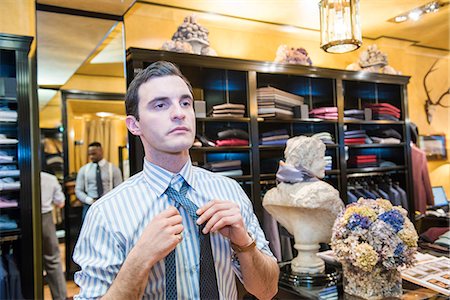 simsearch:649-07559861,k - Customer trying on tie in tailors shop Stock Photo - Premium Royalty-Free, Code: 649-09158910