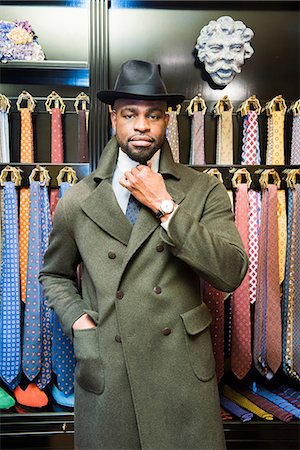 pose fashion - Cool male customer wearing trilby in tailors shop, portrait Stock Photo - Premium Royalty-Free, Code: 649-09158944