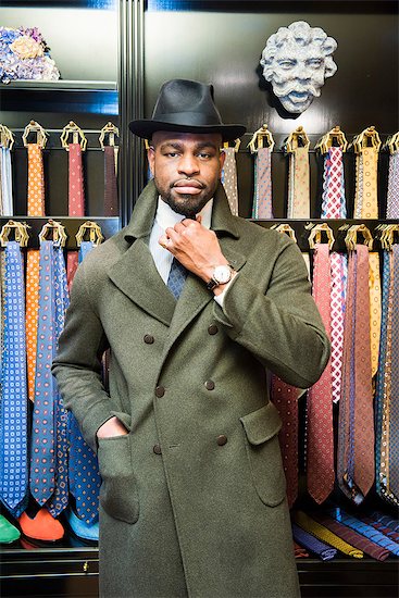 Cool male customer wearing trilby in tailors shop, portrait Stock Photo - Premium Royalty-Free, Image code: 649-09158944