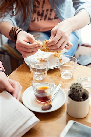 pastries woman cafe - Woman having pastry in cafe Stock Photo - Premium Royalty-Free, Code: 649-09159024