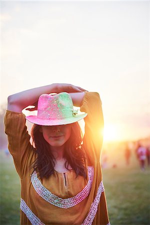 rural fair - Young woman in trilby covered in coloured chalk powder at Holi Festival, overhead view Stock Photo - Premium Royalty-Free, Code: 649-09166430