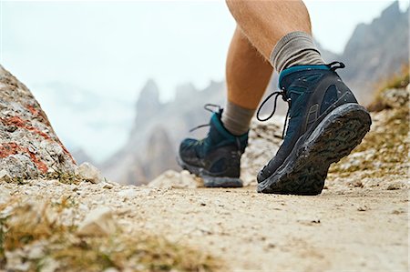 Hiker on dirt track, Canazei, Trentino-Alto Adige, Italy Stock Photo - Premium Royalty-Free, Code: 649-09166521
