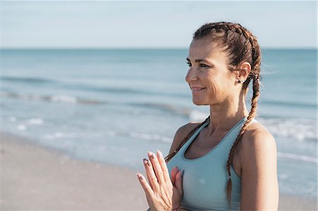 simsearch:649-09061376,k - Woman practising yoga on beach Stock Photo - Premium Royalty-Free, Code: 649-09166860