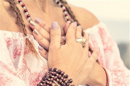 Woman covering chest with hands Stock Photo - Premium Royalty-Free, Code: 649-09166871