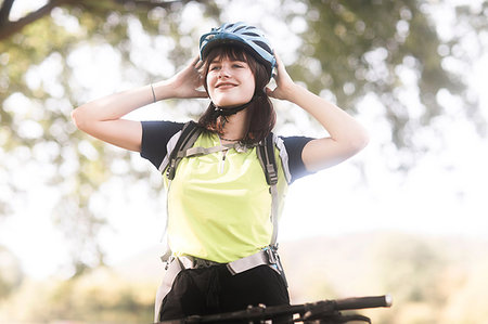 female on bicycle image - Biker stopping in park Stock Photo - Premium Royalty-Free, Code: 649-09182246