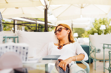 Woman relaxing on terrace Stock Photo - Premium Royalty-Free, Code: 649-09182257