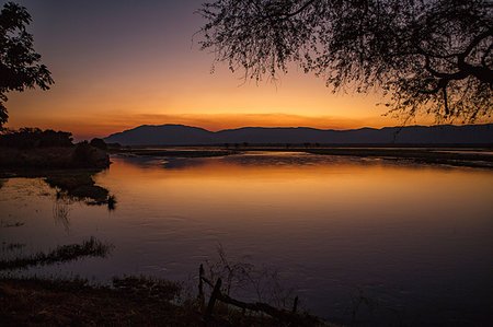 Sunset over Zambezi RIver, Mana Pools, Zimbabwe Stock Photo - Premium Royalty-Free, Code: 649-09182278