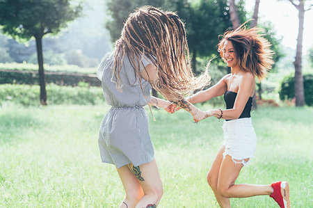 simsearch:649-09195670,k - Girlfriends dancing in park Stock Photo - Premium Royalty-Free, Code: 649-09195653