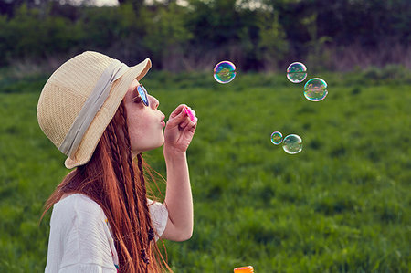 simsearch:649-04247853,k - Girl playing with soap bubbles Stock Photo - Premium Royalty-Free, Code: 649-09195882