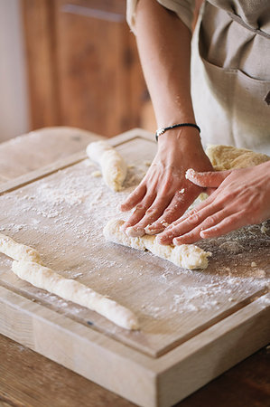 rolling over - Woman preparing dough for gnocchi Stock Photo - Premium Royalty-Free, Code: 649-09195973