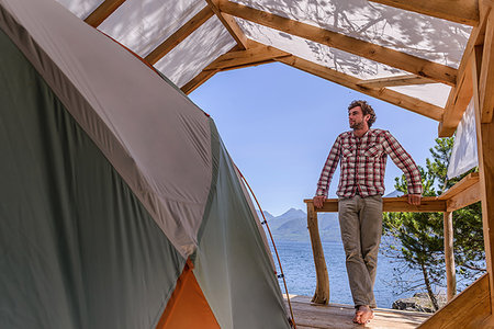 simsearch:649-09196289,k - Man relaxing beside tent, Johnstone Strait, Telegraph Cove, Canada Stock Photo - Premium Royalty-Free, Code: 649-09196307