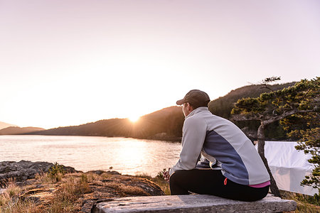 simsearch:649-08823983,k - Woman relaxing by lakeside, Johnstone Strait, Telegraph Cove, Canada Stock Photo - Premium Royalty-Free, Code: 649-09196303