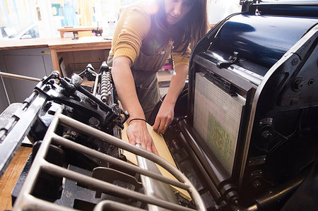 simsearch:6102-08942371,k - Woman preparing printer in shop Stock Photo - Premium Royalty-Free, Code: 649-09196398