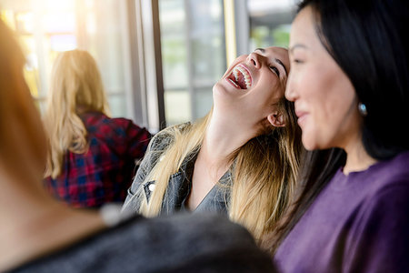 Female student friends laughing and chatting in university Stock Photo - Premium Royalty-Free, Code: 649-09196528