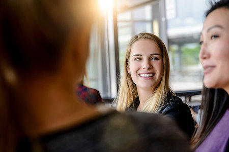 Female student friends chatting by university window Stock Photo - Premium Royalty-Free, Code: 649-09196521