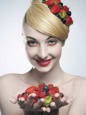 simsearch:614-08871355,k - Woman holding handful of fruit Stock Photo - Premium Royalty-Free, Code: 649-09205888