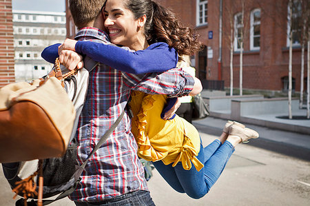 simsearch:614-08869426,k - Couple hugging on city street Stock Photo - Premium Royalty-Free, Code: 649-09206132